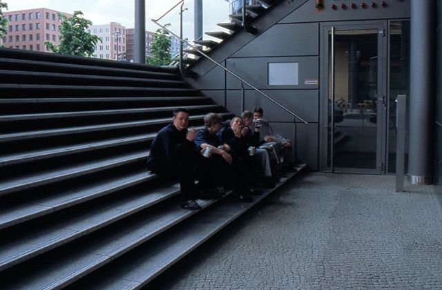 color photo, smoking adolescents on stairs